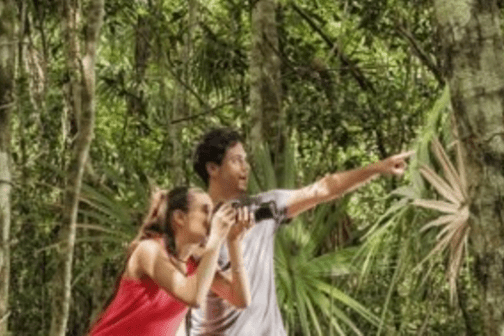 couple on hike in rainforest